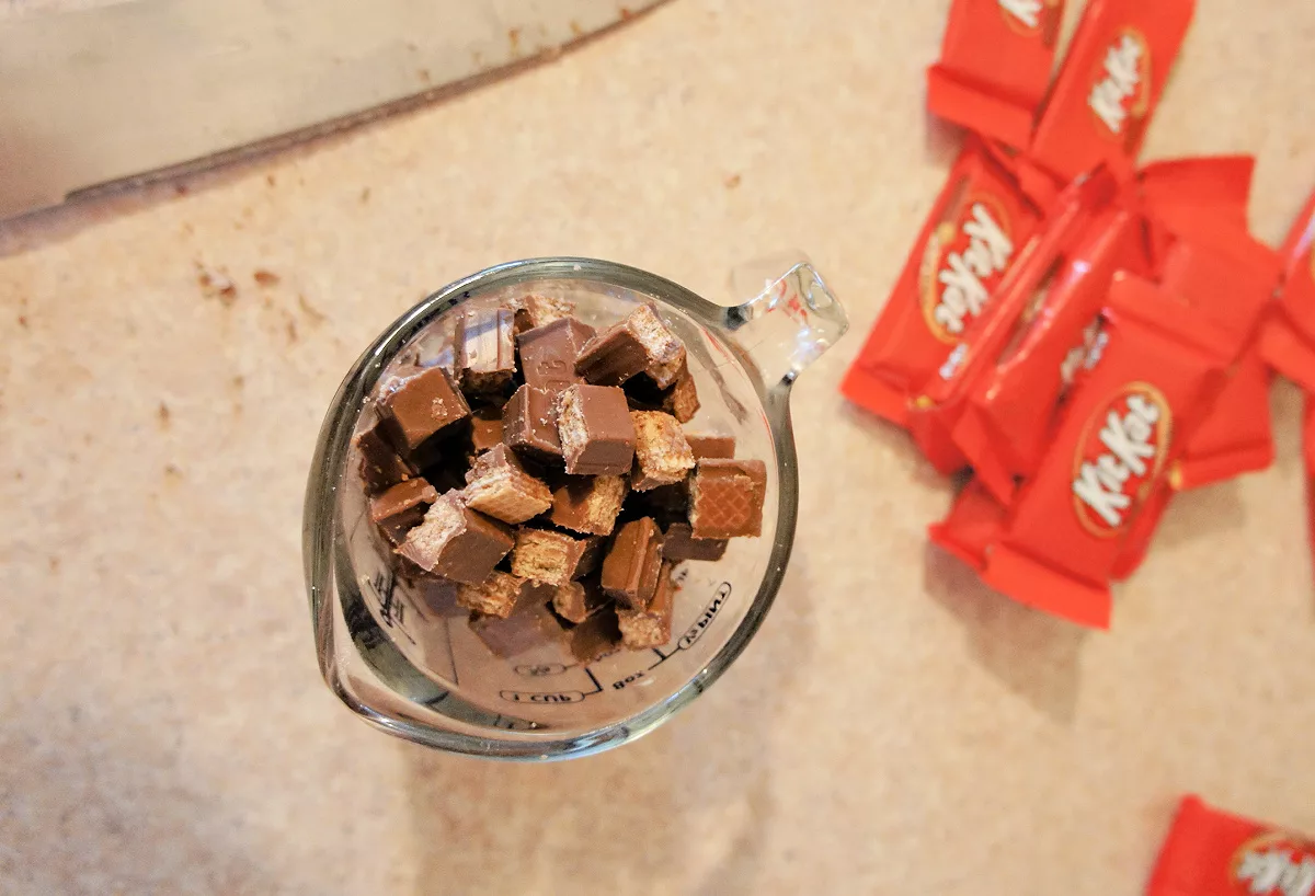 measuring cup filled with chocolate candies