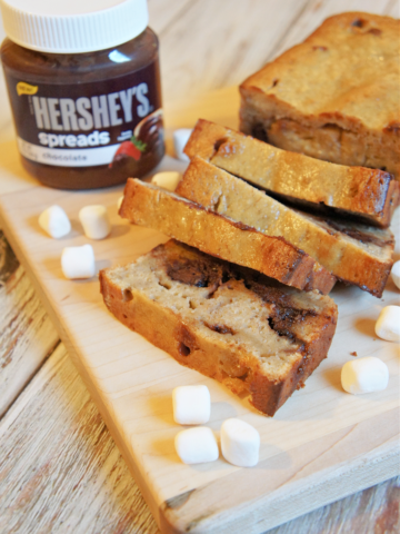 Rocky Road Banana Bread with a jar of chocolate spread and mini marshmallows