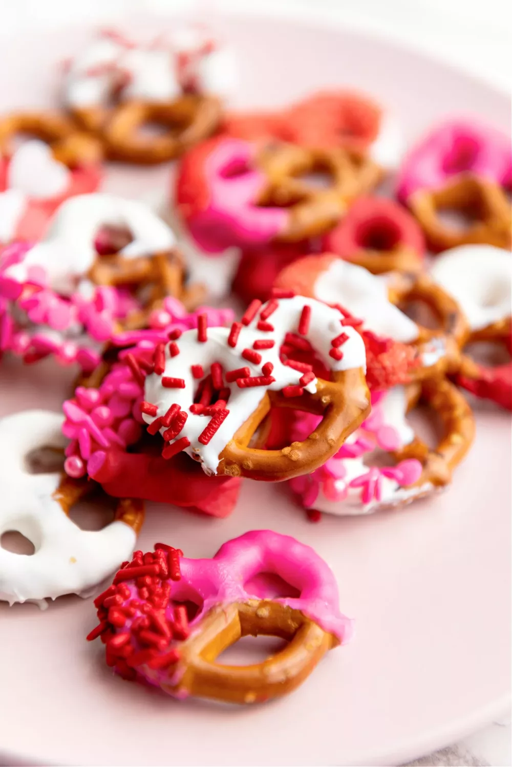 Pretzel Candy Recipes: Pretzel covered in white chocolate and sprinkled with red and pink sugar and sprinkles