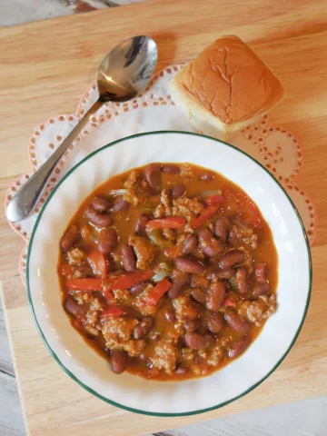 Pumpkin and Lamb Chili in a bowl with a piece of bread
