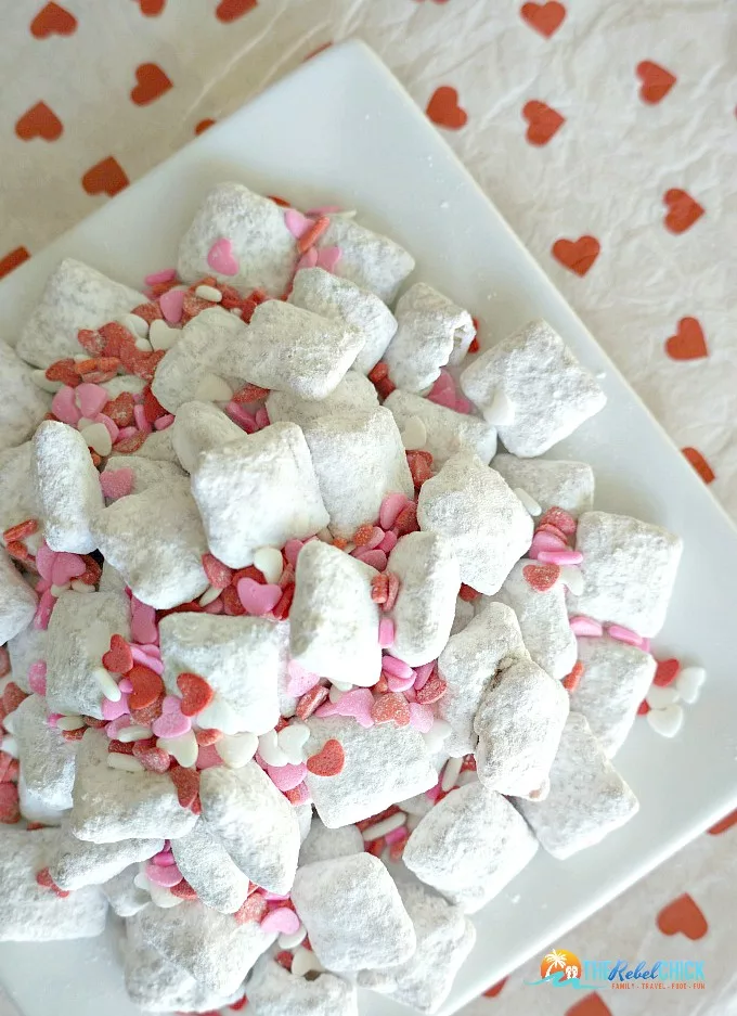 Valentine's Day Muddy Buddies Recipe with red and pink Valentines Day heart sprinkles