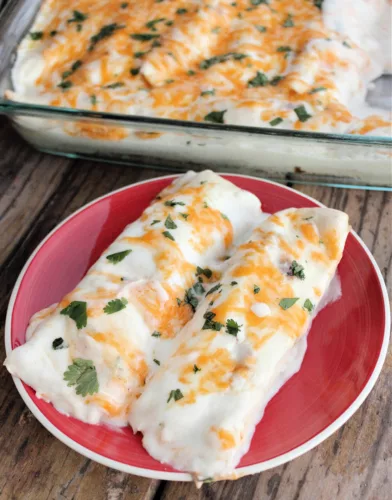 Easy Weeknight Chicken Enchiladas covered in melted cheese