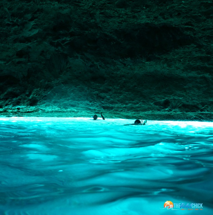 people swimming in the blue room cave in curacao