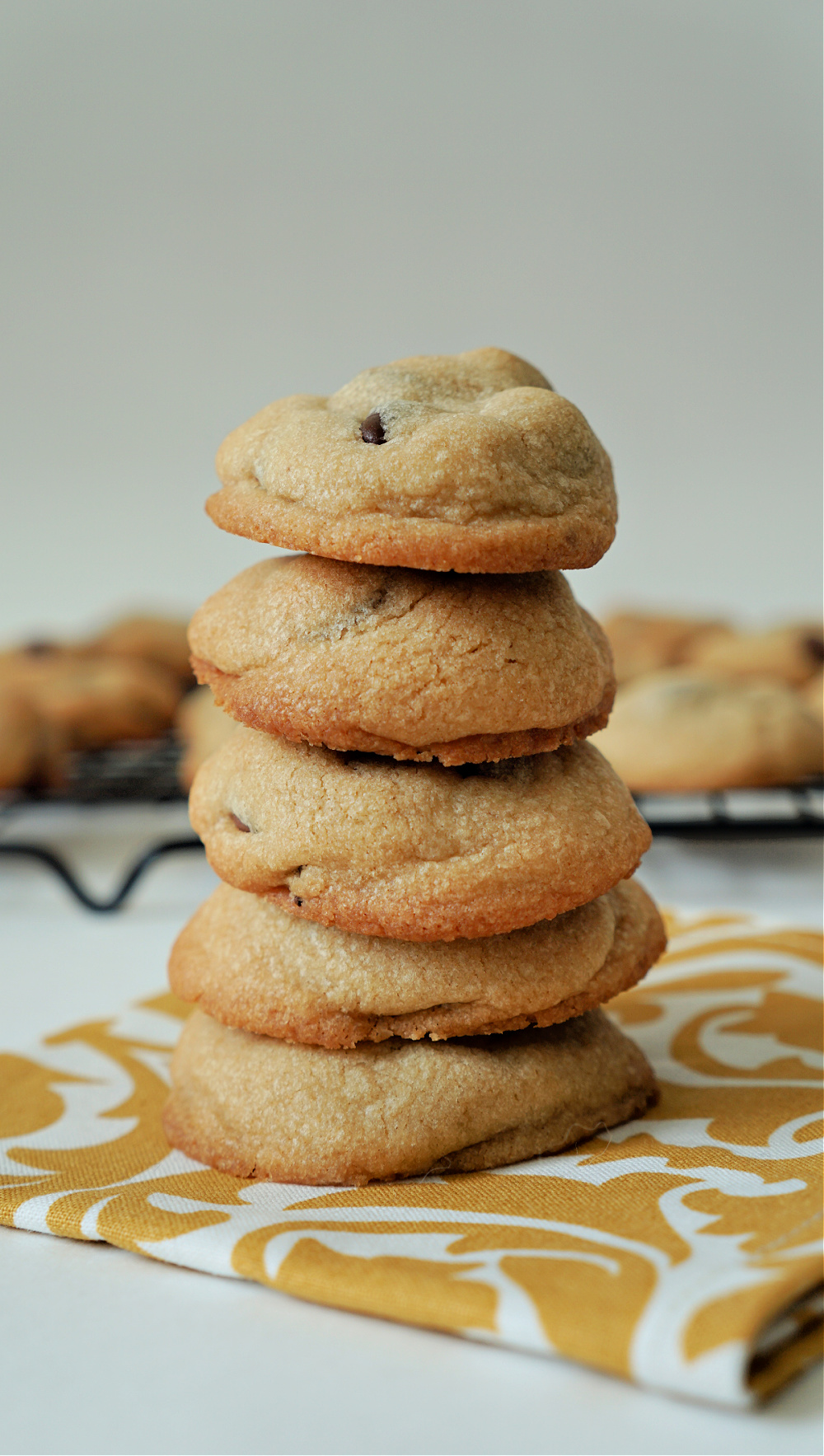 a stack of cookies piled high on a napkin