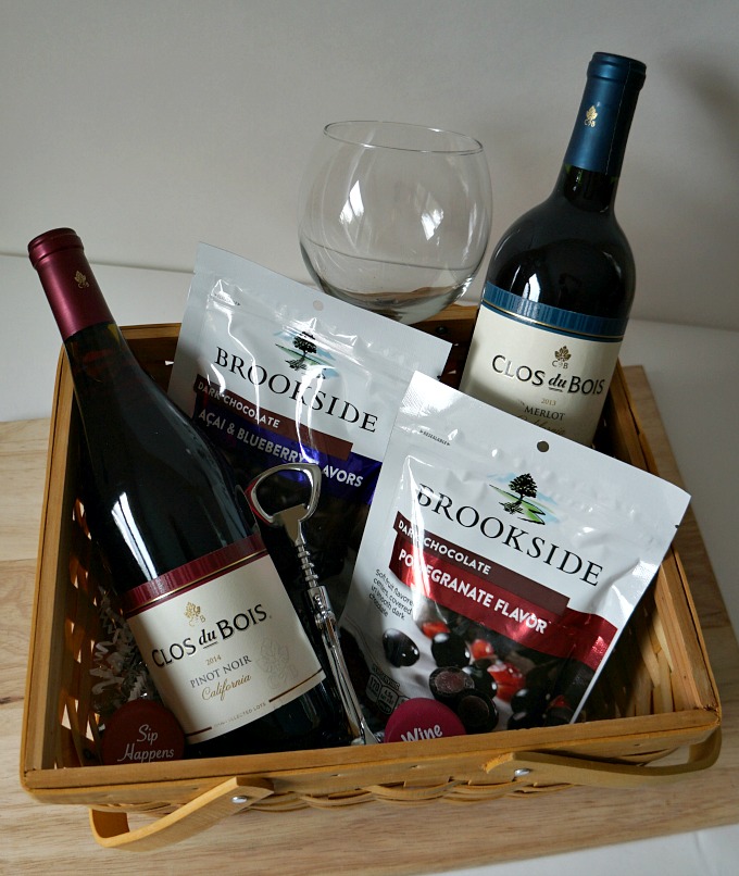 Clos du Bois wines and brookside chocolates in a gift basket with a wine glass