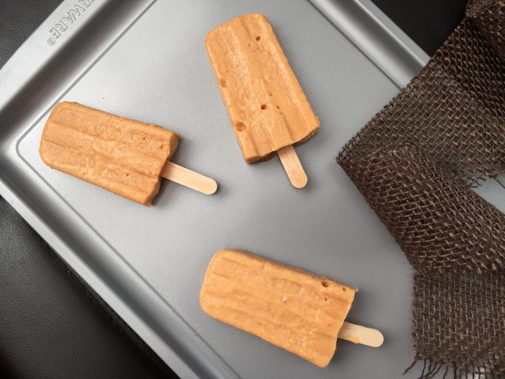 A tray of pumpkin spice popsicles.
