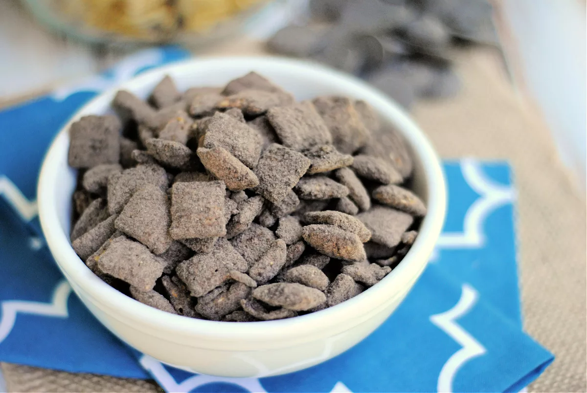 Double Chocolate Mint Puppy Chow in a bowl on a tablecloth