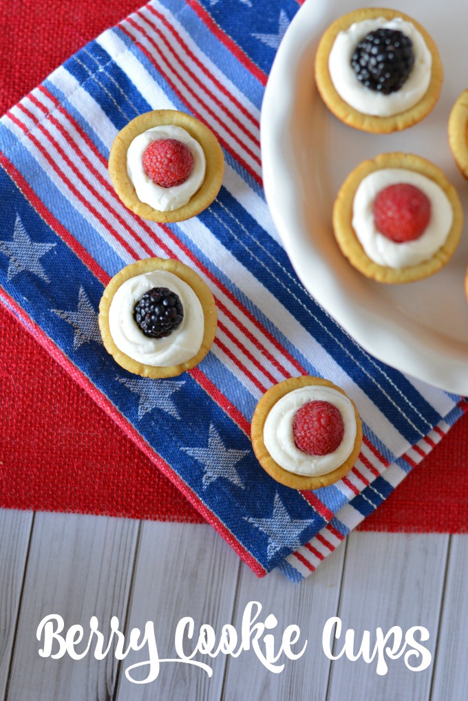 sugar cookie cups with cream cheese filling and fresh berries on top