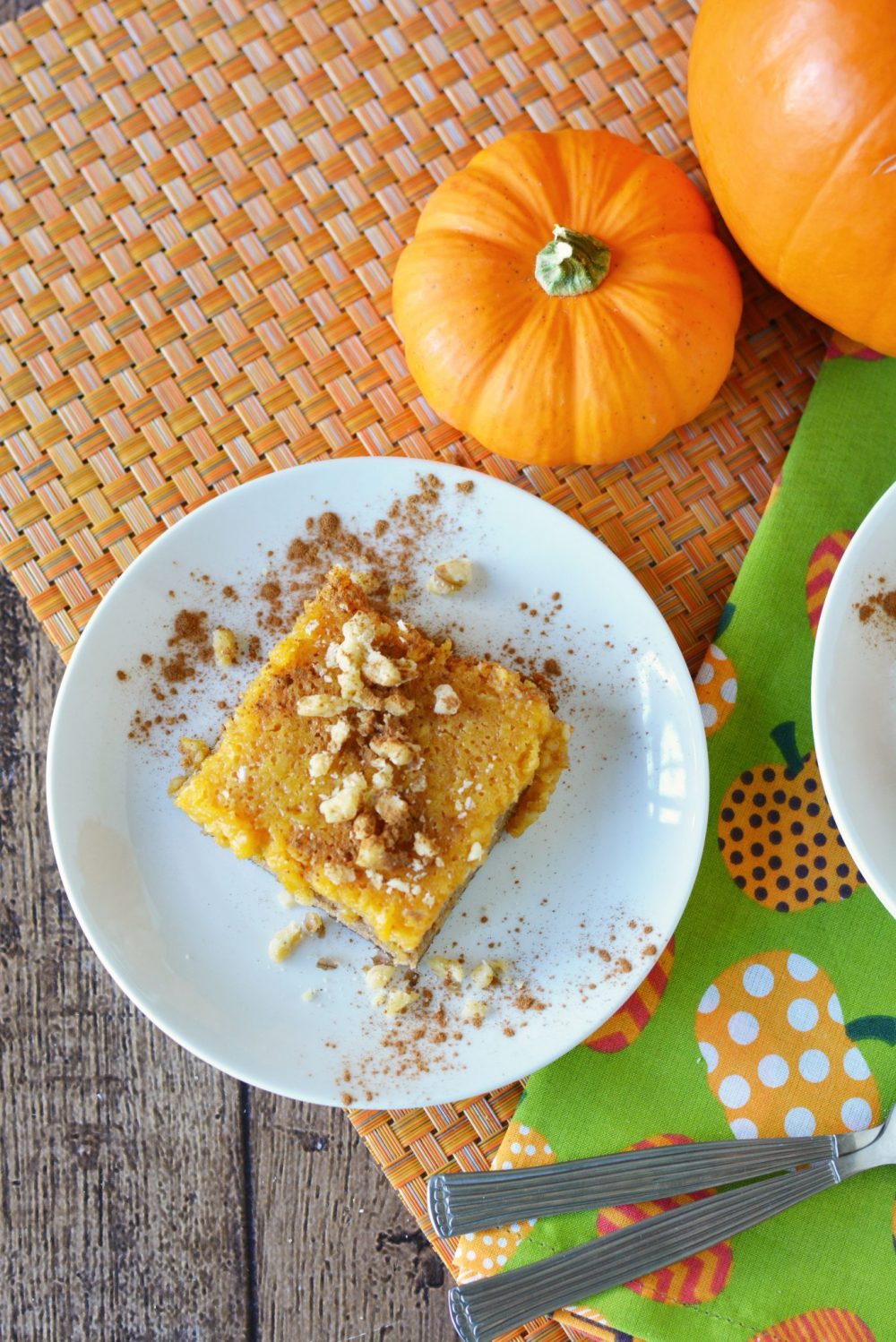 Pumpkin Cake topped with nuts on a plate