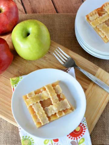 Pie with apples in the background