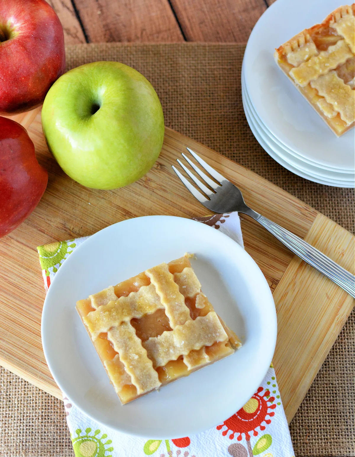 Apple Slab Pie with apples in the background