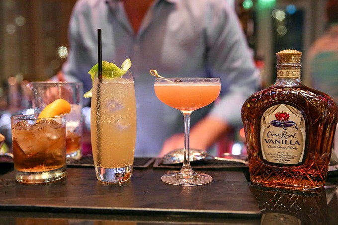 Crown Royal Vanilla cocktails on a bar with a bottle next to them