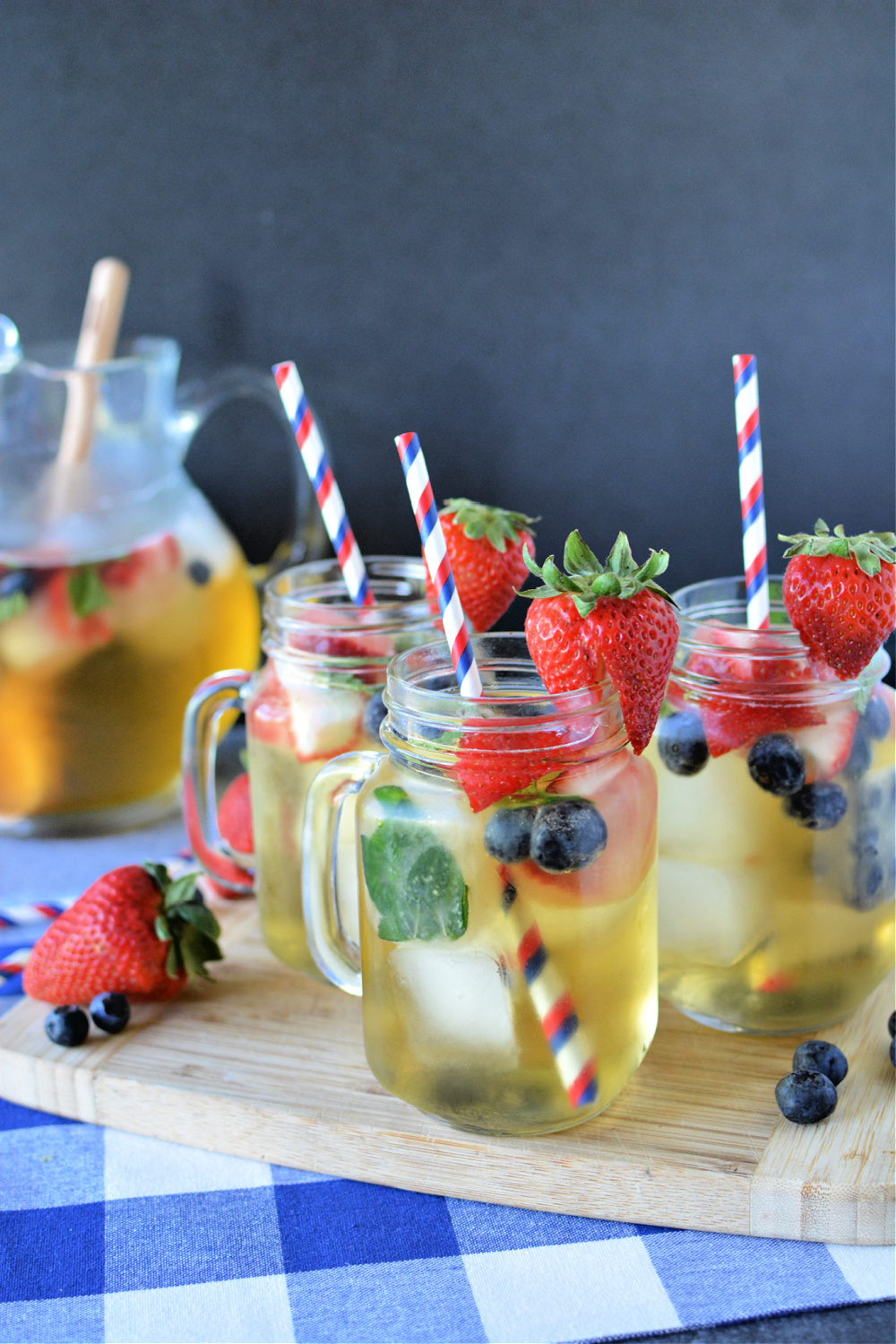 Red White and Blue Sangria in a pitcher with glasses