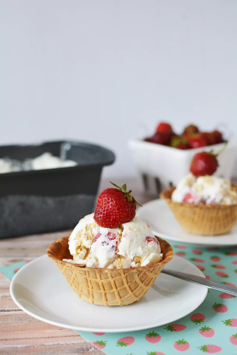 Strawberry Cheesecake Ice Cream in waffle cone bowls