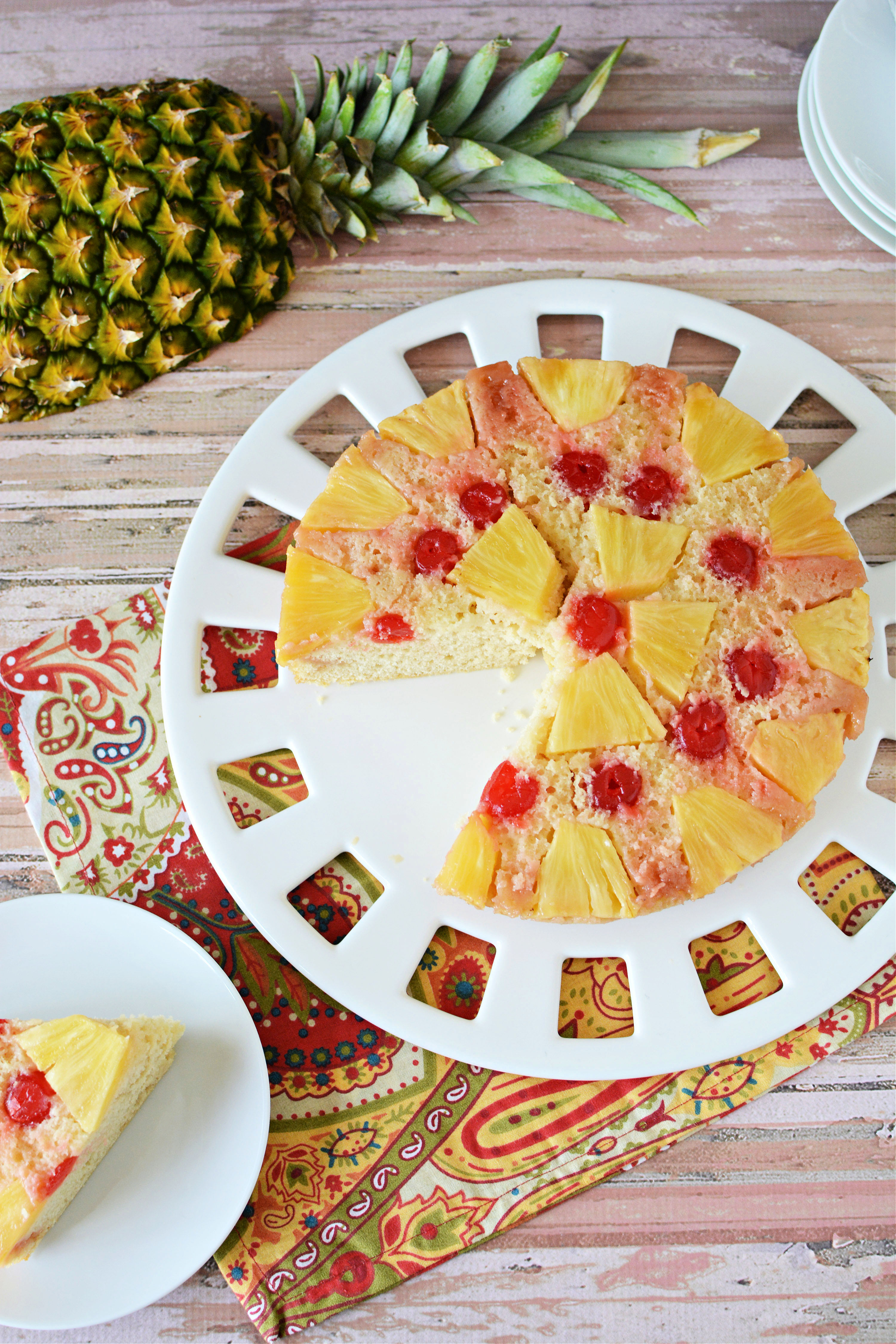 cake covered in pineapple and cherries