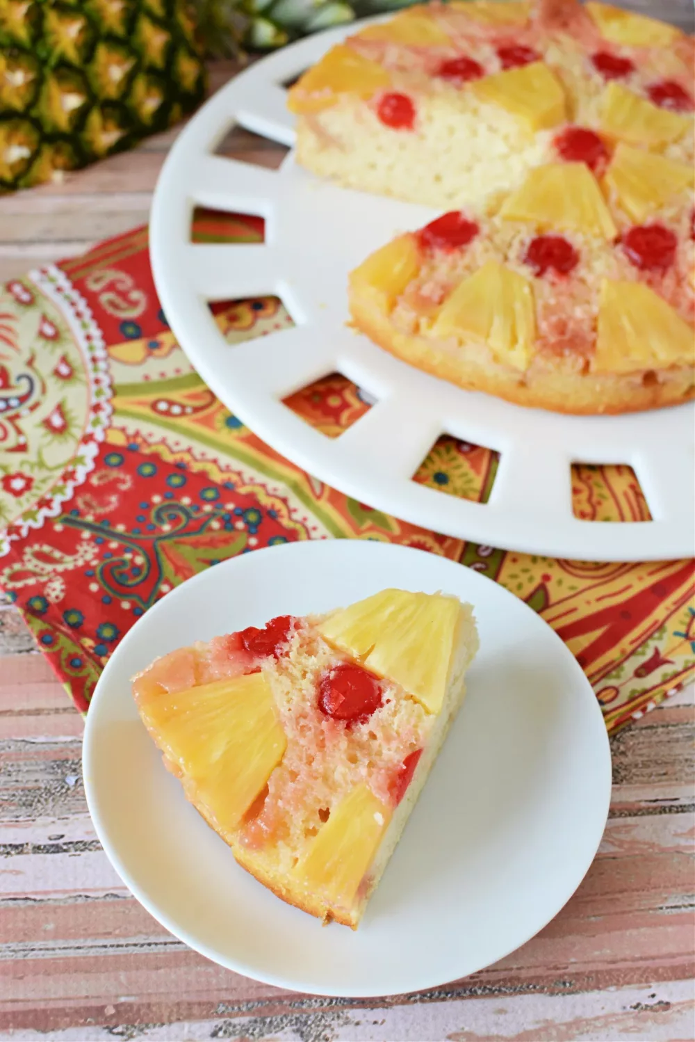 cake covered in pineapple and cherries