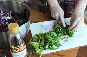 Chopping cilantro for spicy cole slaw