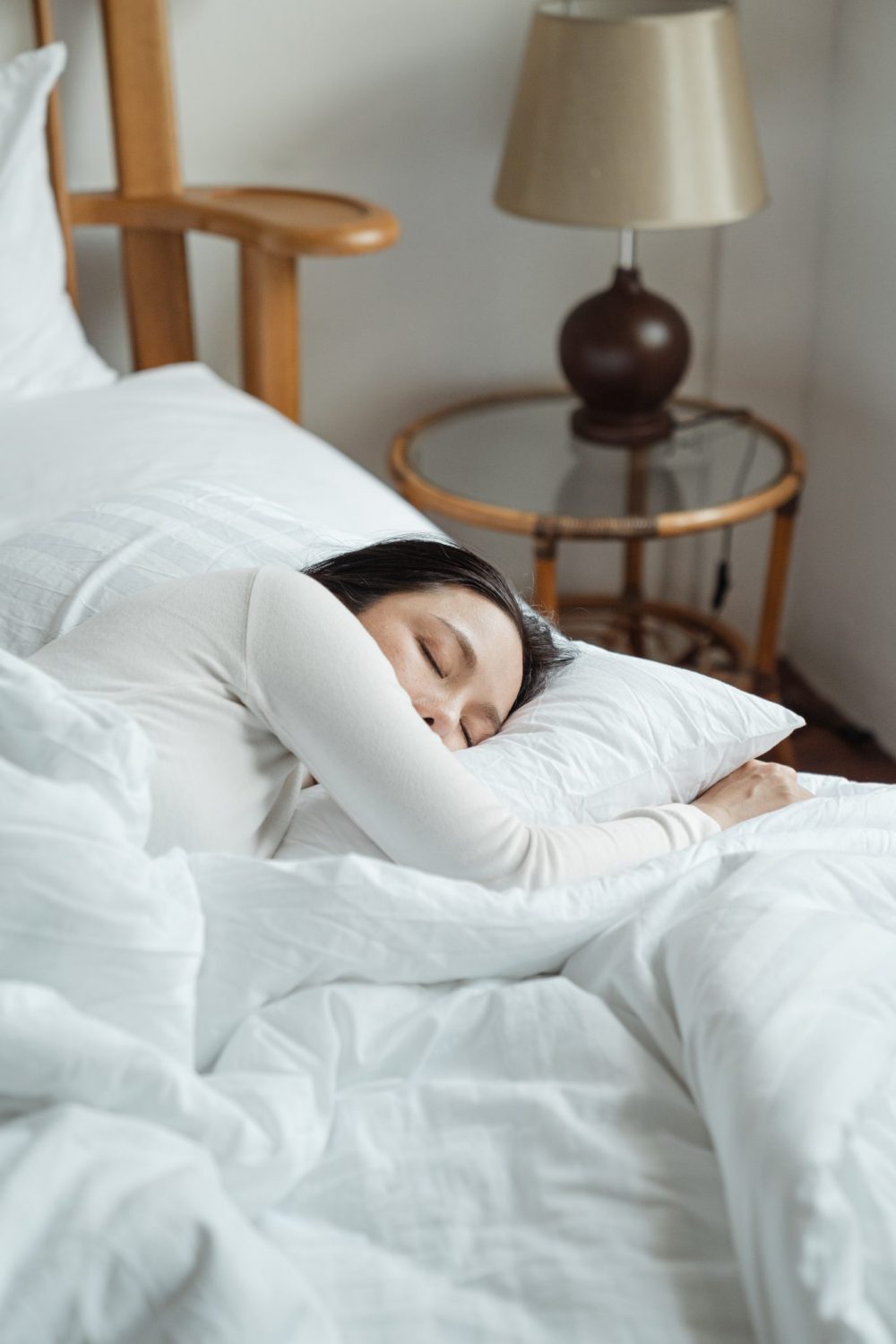 woman in bed getting a good night of sleep