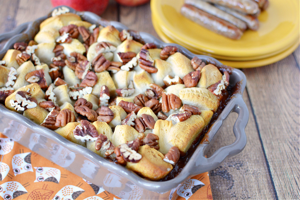 casserole dish filled with bread, apples and pecans