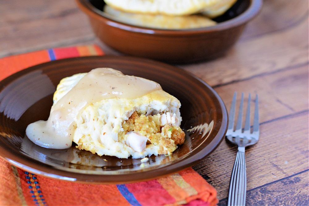baked biscuit filled with turkey, stuffing and mashed potatoes