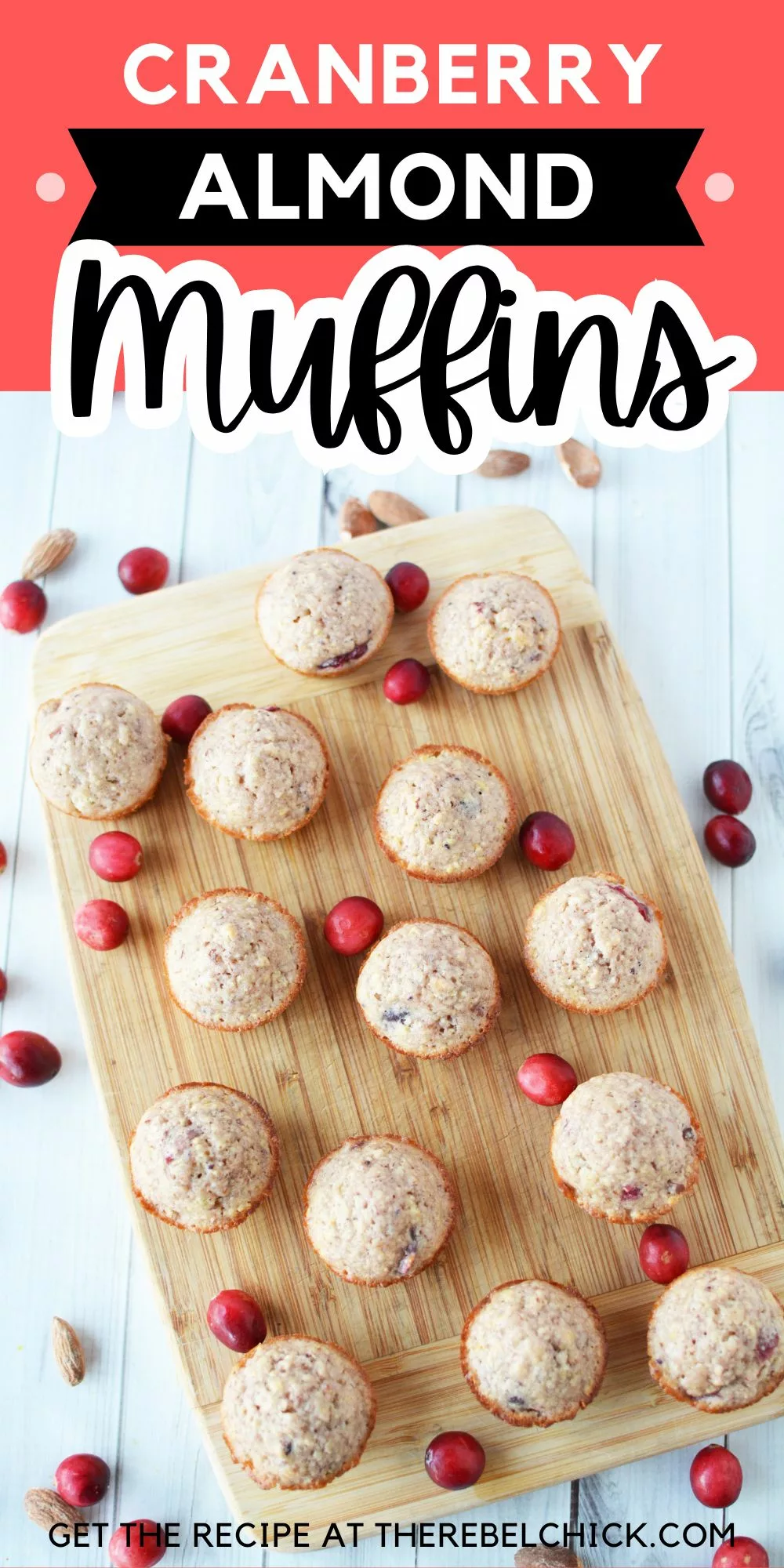 Mini Muffins on a wooden cutting board with fresh cranberries and sliced almonds