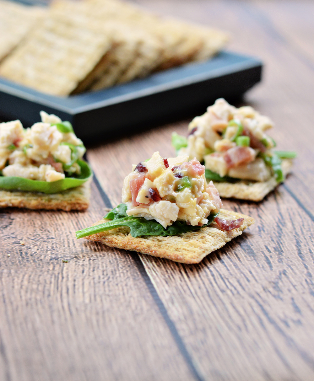 Chicken salad with bacon and cranberries on a cracker