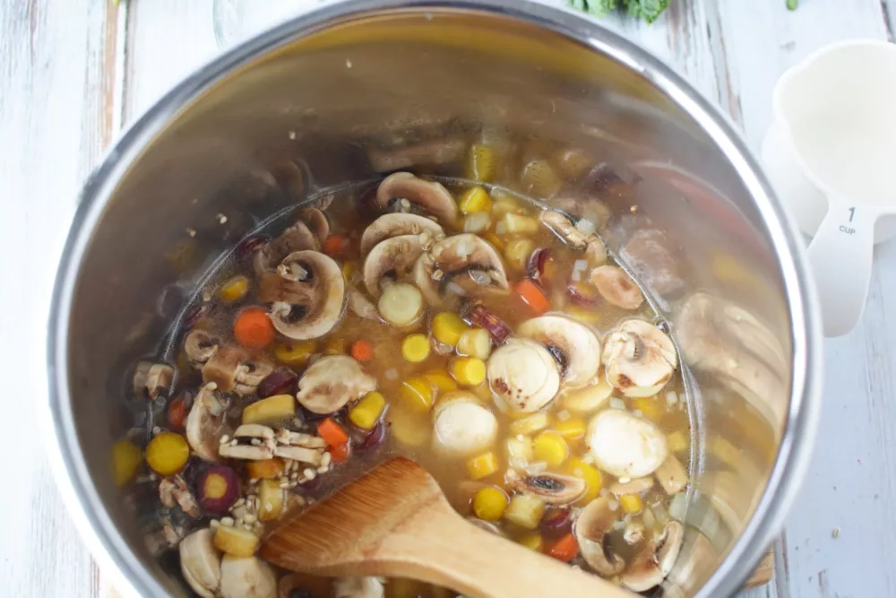 mushrooms, carrots, corn in a pan