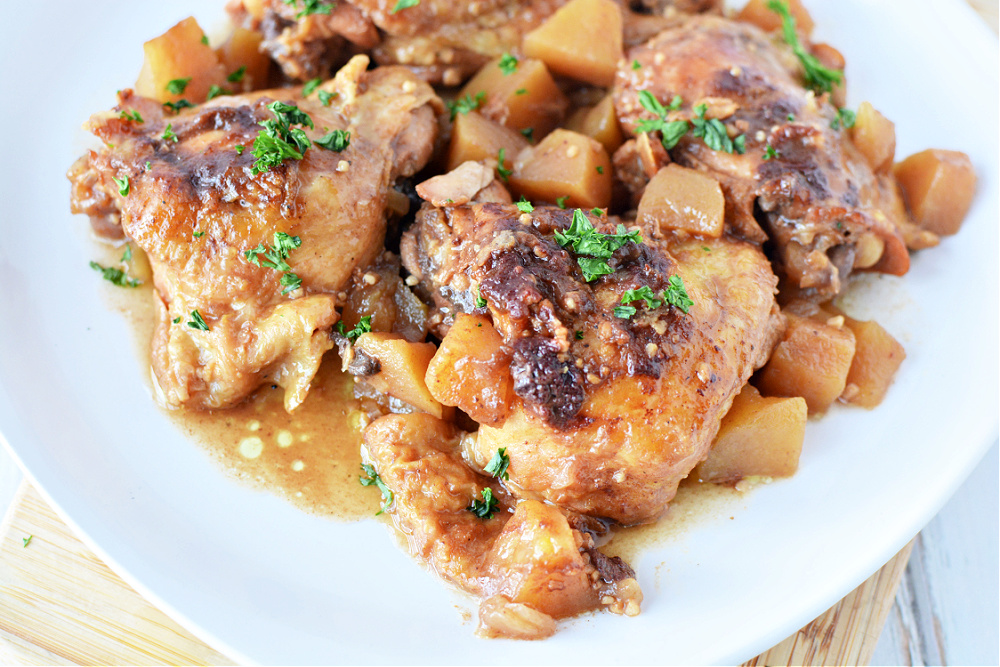 overhead shot of chicken thighs with chunks of apples