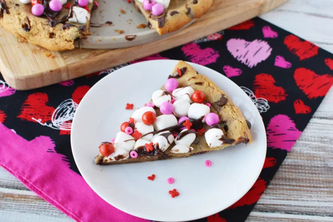 Valentine's Day Cookie Candy Pizza covered in marshmallows and hot fudge