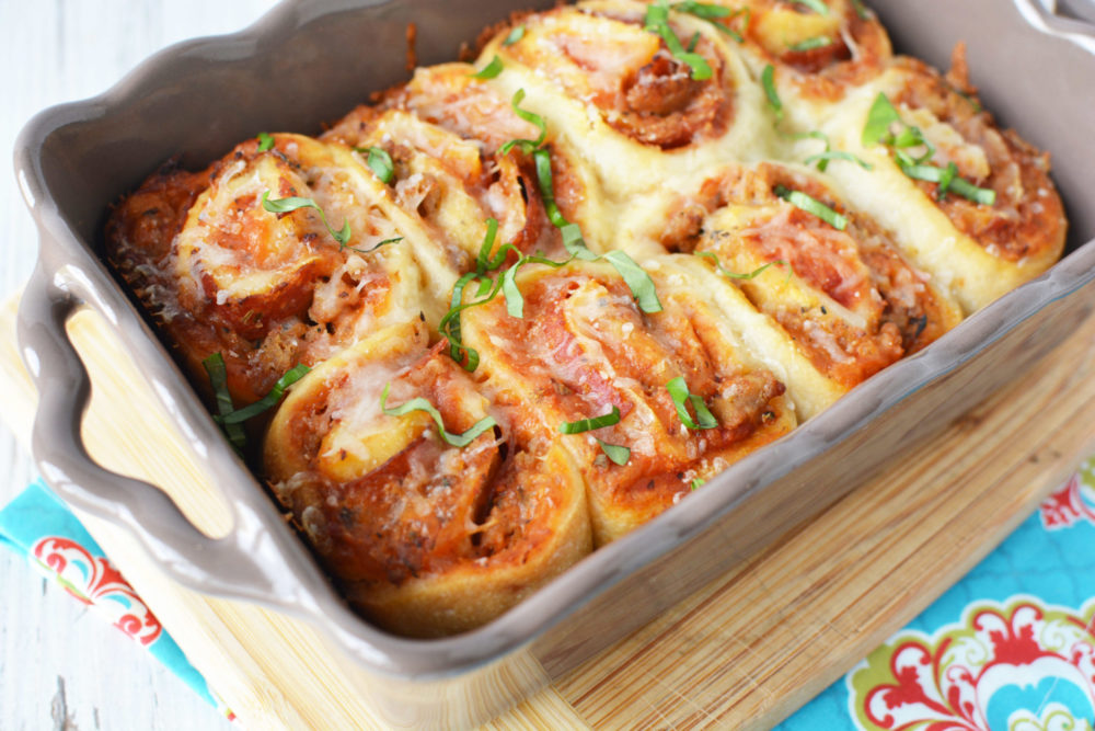 A pan of pizza roll casserole with cheese and pepperoni, rolled into dough and baked.
