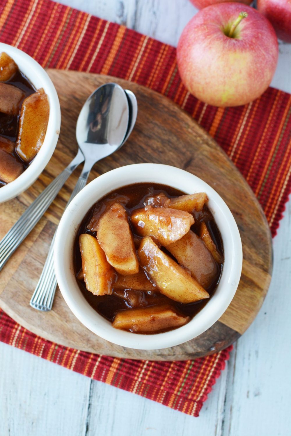 small bowl full of chunks of apple covered in cinnamon and sauce
