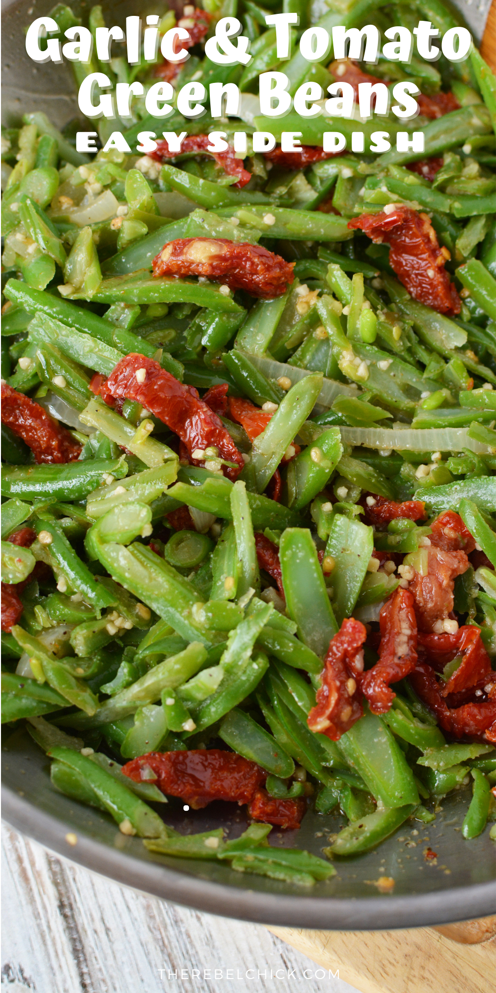 green beans, garlic, onions and tomatoes in a frying pan