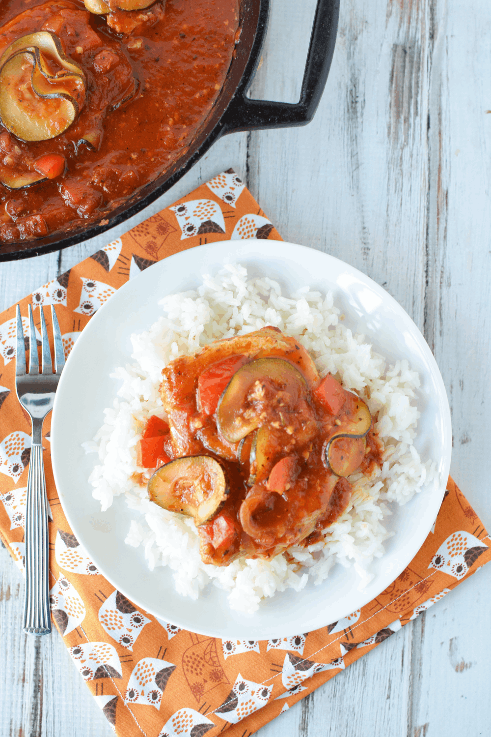 Pork Chops with tomato sauce over a bed of white rice
