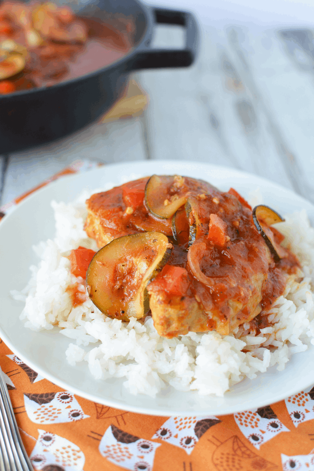 Chops with tomato sauce over a bed of white rice