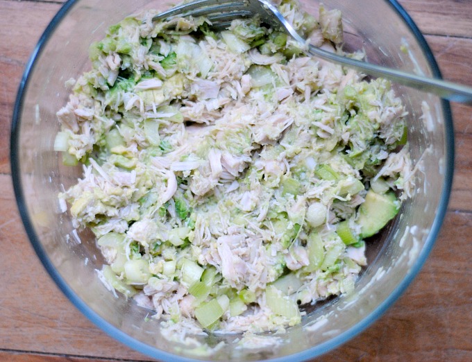 A bowl of chicken salad made with avocado.