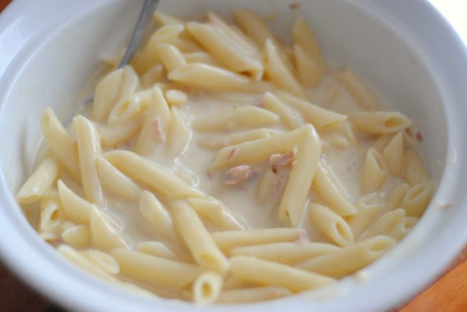 penne pasta and tuna fish in a bowl
