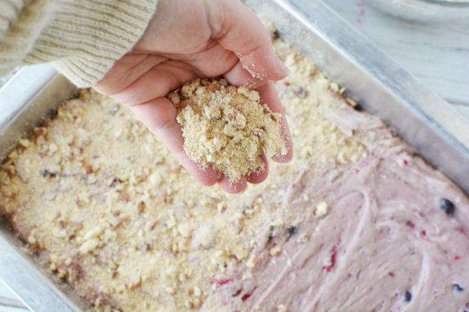 batter in a pan with crumble going on top