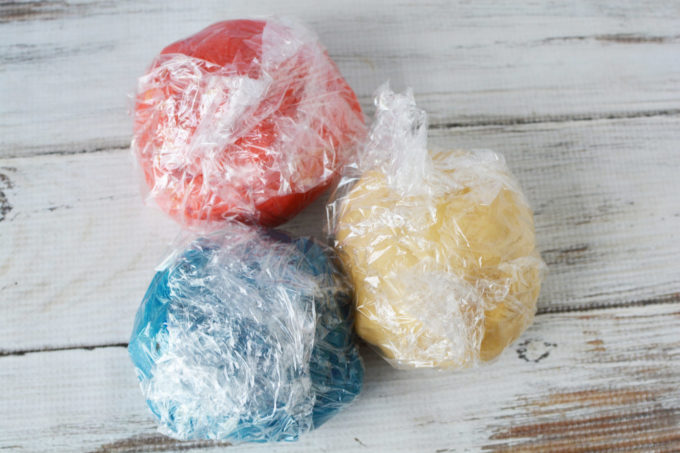 red white and blue cookie dough in plastic wrap