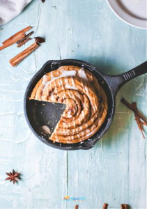cinnamon roll cake in a cast iron skillet