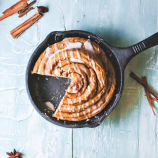 cinnamon roll cake in a cast iron skillet