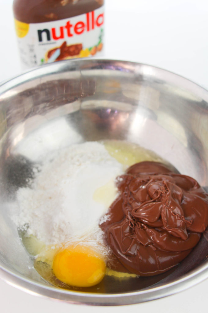 Nutella, flour and egg in a mixing bowl