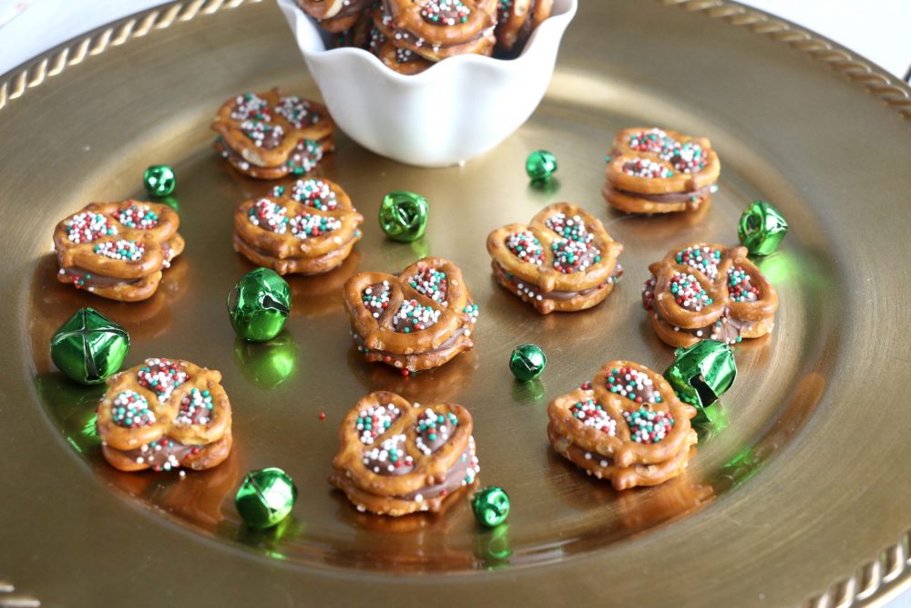 mini pretzels with a rolo candy and green and red sprinkles