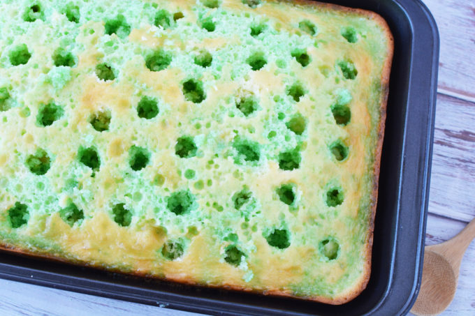 Lime JELLO poured into holes in a white cake