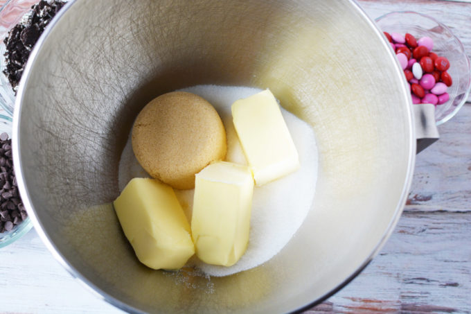 butter, sugar and brown sugar in a stainless steel mixing bowl