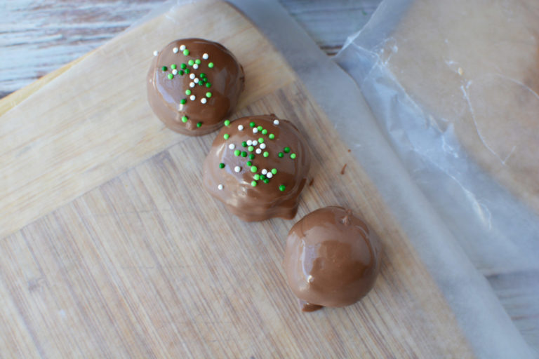chocolate balls sprinkled with green and white jimmies