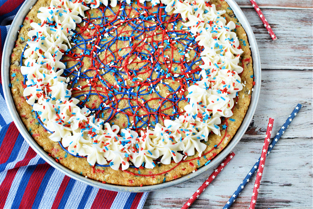 A completely decorated red, white, and blue cookie pizza 
