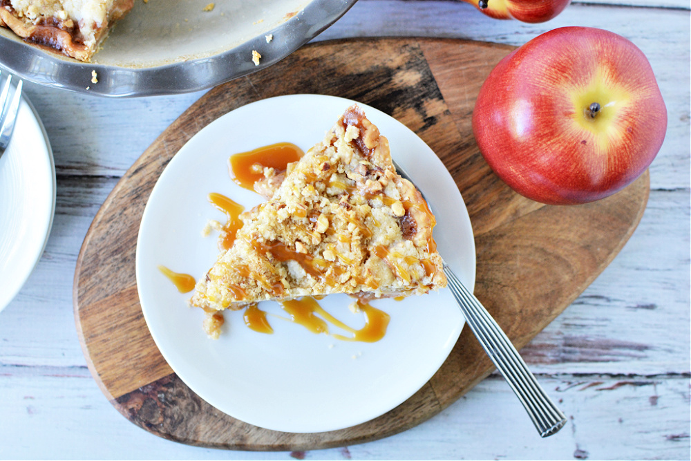  a big piece of apple pie with streusel on top