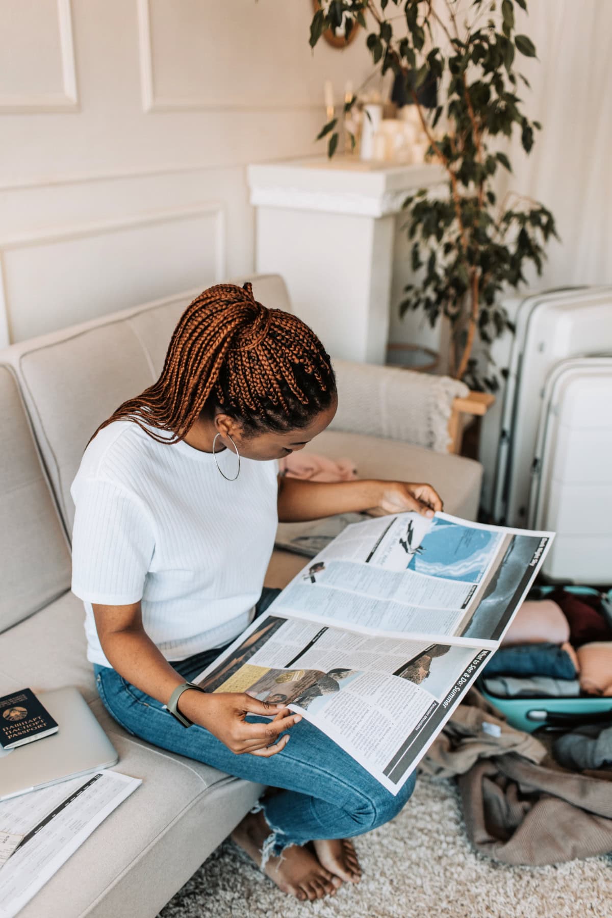 woman looking at a travel magazine