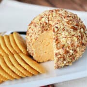 Classic Cheese Ball Appetizer on a white platter with crackers