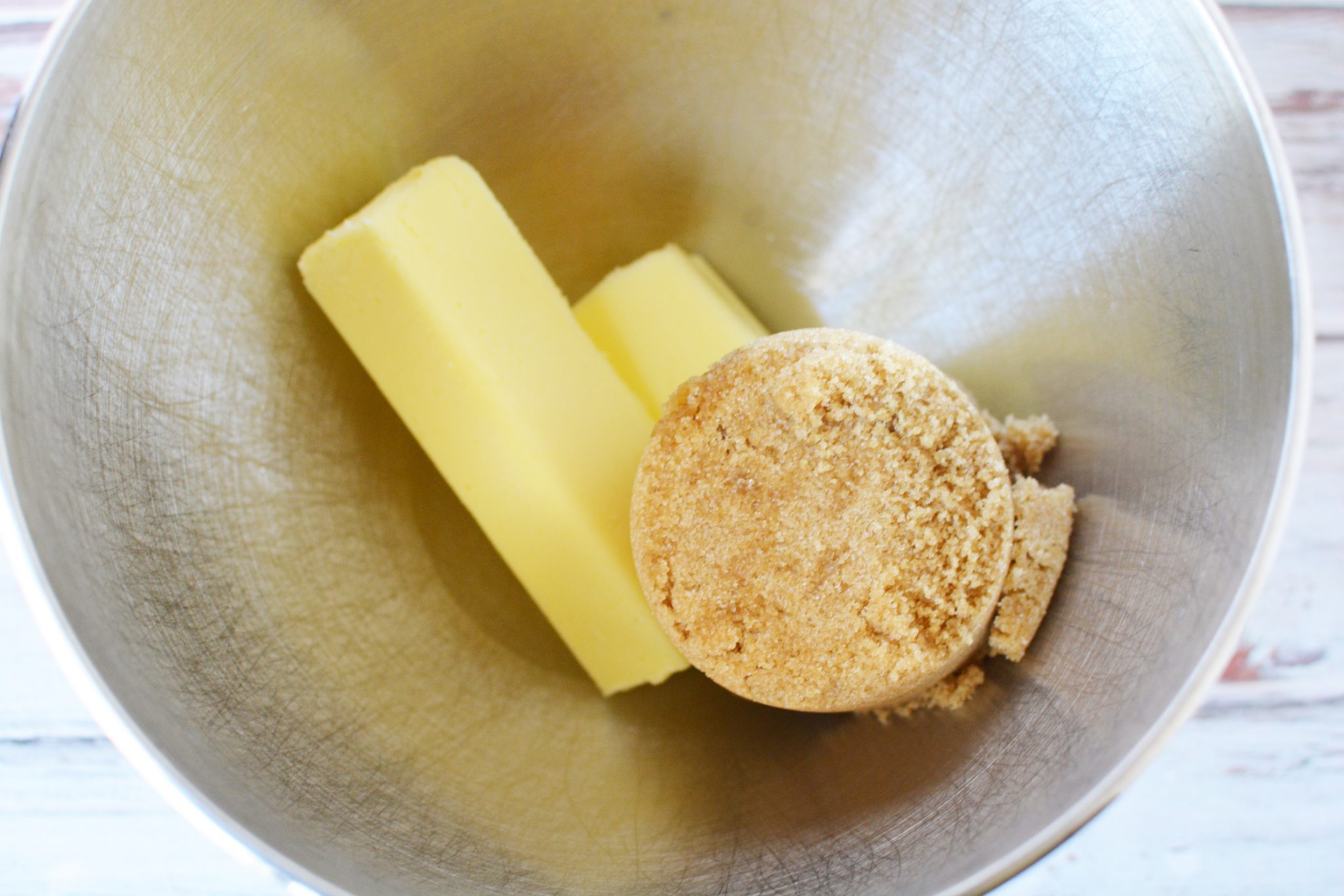 sticks of butter and light brown sugar in a mixing bowl